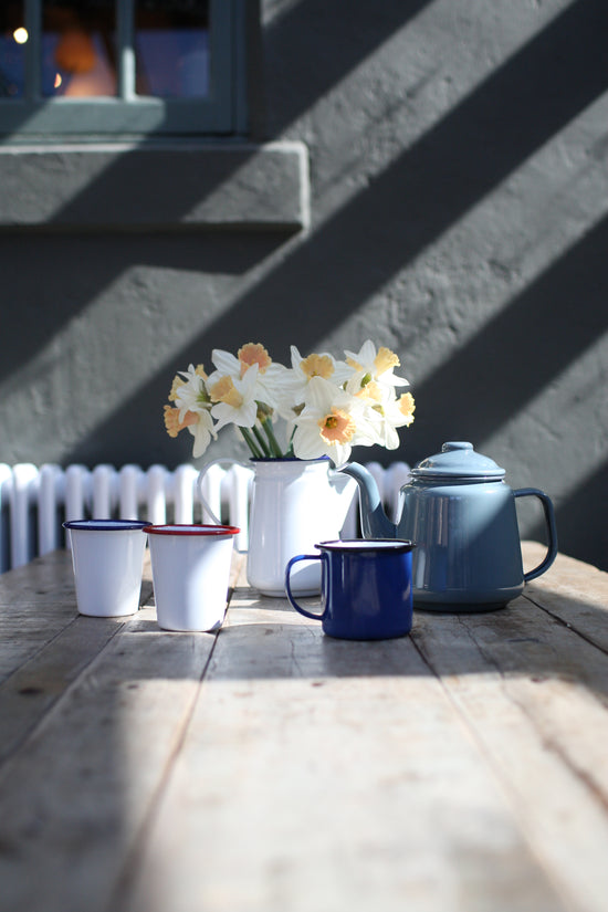 a picture of a collection of enamelware products on a table
