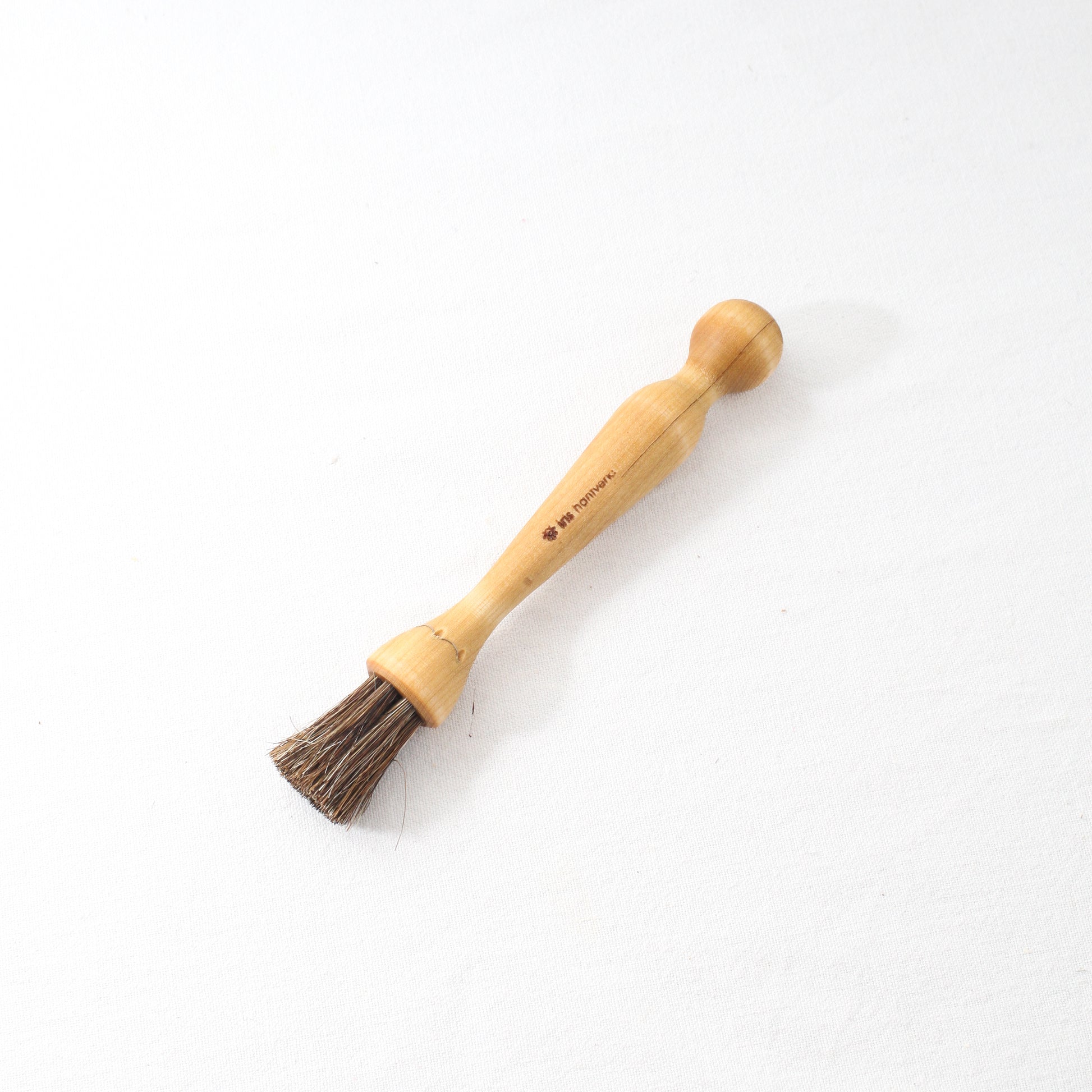 a wooden mushroom or pastry brush