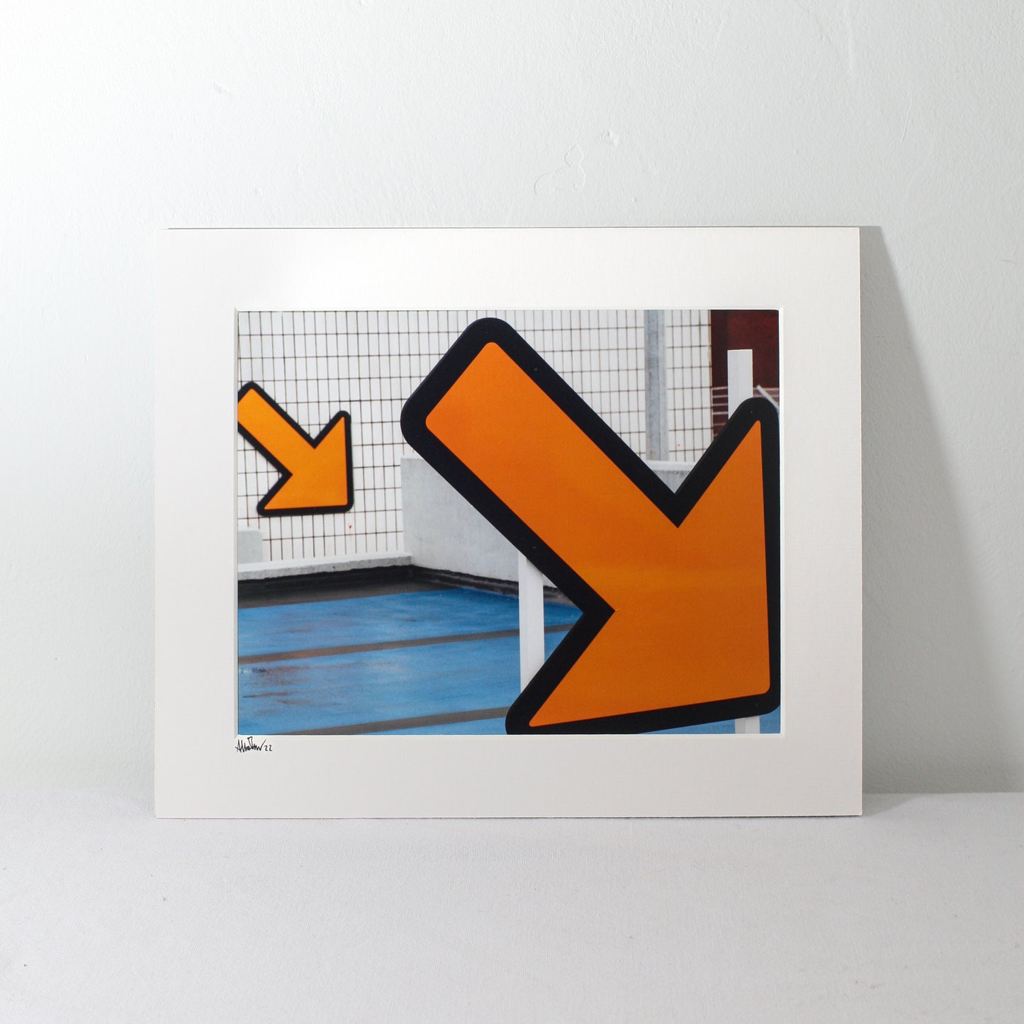 a mounted picture of orange arrows from preston bus station car park