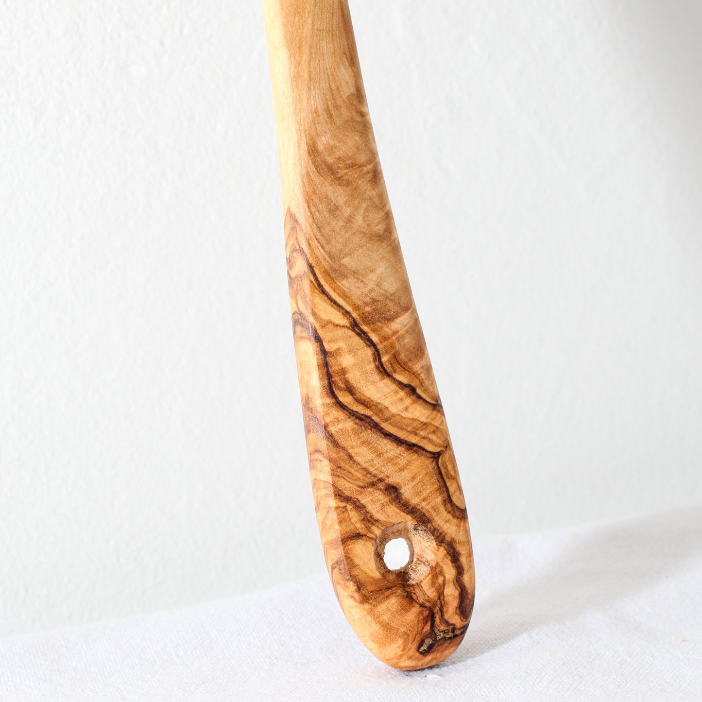 bottom of an olive wood kitchen spoon